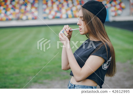 girl lighting a cigarette girl lighting a cigarette 42612995