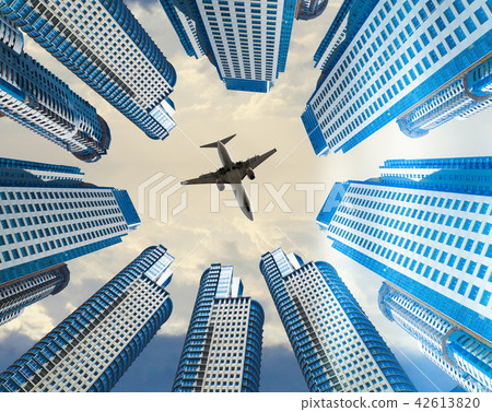 Plane encircled by buildings 42613820