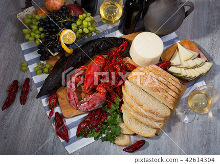 Still life with cooking marine products, wine and cheese 42614304