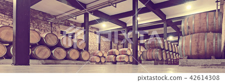 winery with many wooden barrels winery with many wooden barrels 42614308