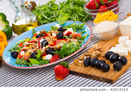 Ingredients and ready-made salad with rocket Ingredients and ready-made salad with rocket 42614329