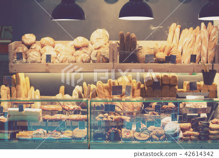 Modern bakery with assortment of bread Modern bakery with assortment of bread 42614342
