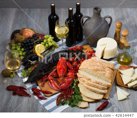 Smoked sturgeon with lobster, crayfishes, bread, cheese, fruits and wine 42614447
