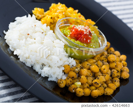 Healthy food of garbanzos and rice with red and green sauces Healthy food of garbanzos and rice with red and green sauces 42614663