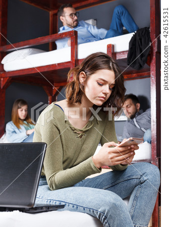 Upset girl with smartphone Upset girl with smartphone 42615531