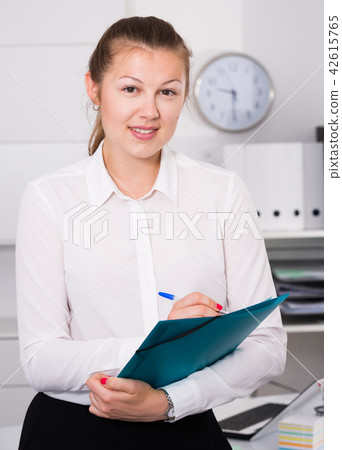 Businesswoman is signing agreement papers of financial nature 42615765