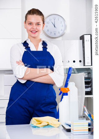 House worker woman is satisfied after cleaning House worker woman is satisfied after cleaning 42615909