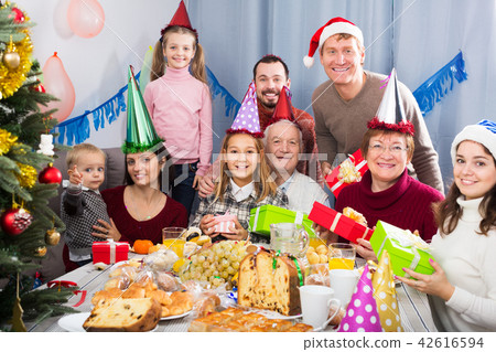 Family exchanging Christmas gifts 42616594