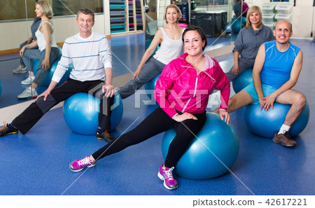 people stretching on fitness balls 42617221