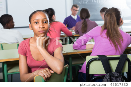 lonely school pupil sitting away lonely school pupil sitting away 42617880