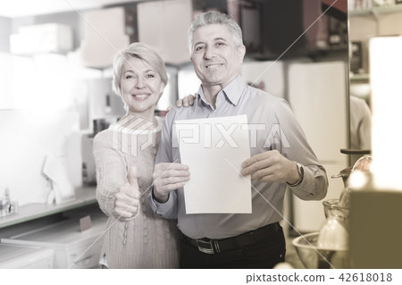 Mature couple are buying in store on credit 42618018