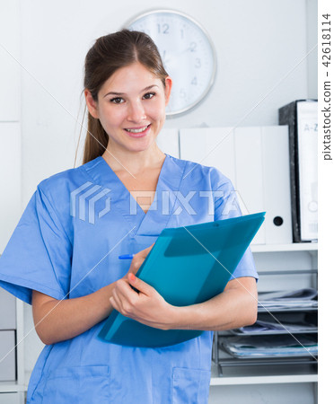 Doctor assistant noting prescriptions Doctor assistant noting prescriptions 42618114
