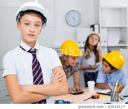 Teenager boy engineer and children with plan Teenager boy engineer and children with plan 42618117