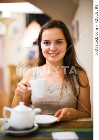 Young girl rests in cafe 42618393