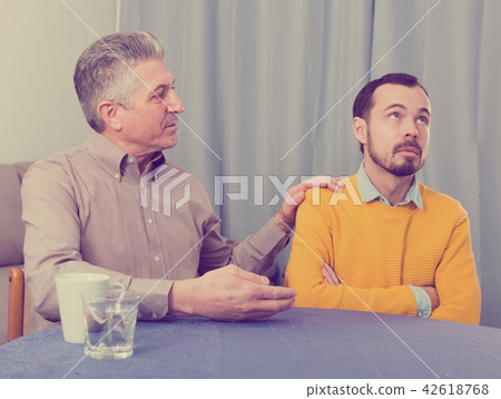 Mature father and son serious talk Mature father and son serious talk 42618768
