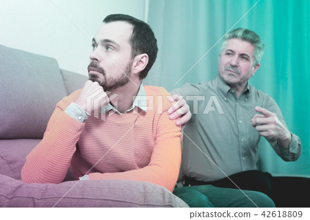 Adult father and son solve problems Adult father and son solve problems 42618809
