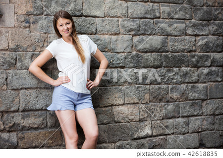 Romantic girl with stone wall background 42618835