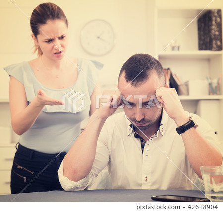 Man is upset because he quarrel with his wife Man is upset because he quarrel with his wife 42618904