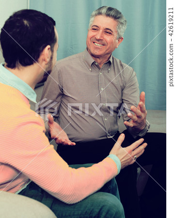 Adult father and son friendly conversation Adult father and son friendly conversation 42619211