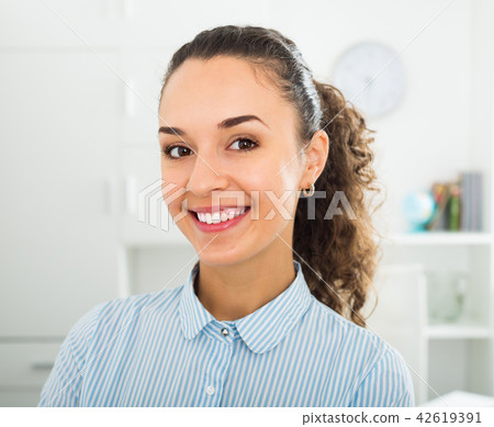 Successful young girl working in modern office Successful young girl working in modern office 42619391