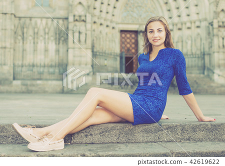 Young woman is posing sitting in blue dress Young woman is posing sitting in blue dress 42619622