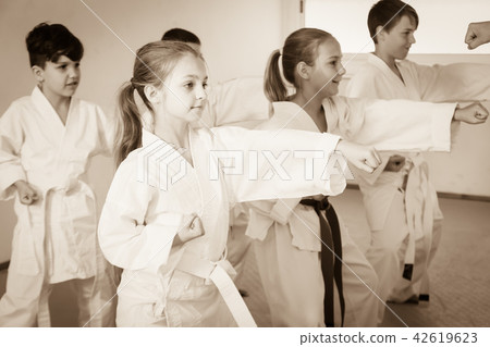 Children training a new moves with coach Children training a new moves with coach 42619623