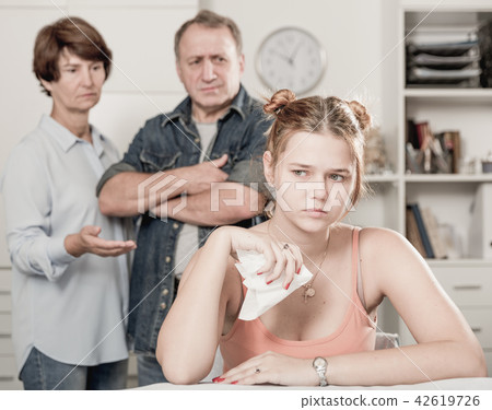 Adult woman is upseting and her parents are sympathying with her Adult woman is upseting and her parents are sympathying with her 42619726