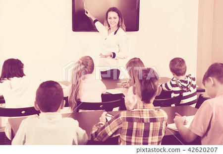 Little children with teacher in classroom 42620207