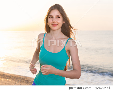 Sportswoman is jogging 42620351