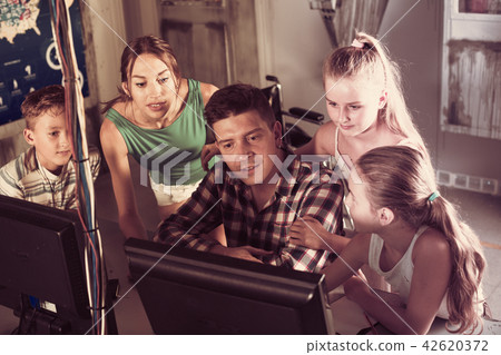 Young family is passing of quest room stylized under laboratory 42620372