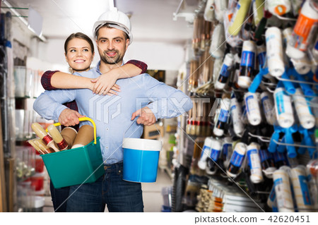 Couple buying paint and instruments 42620451