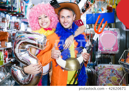 Smiling guy and girl are happy shopping Smiling guy and girl are happy shopping 42620671