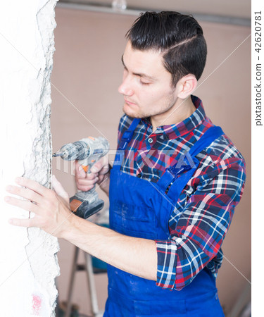 Handyman working with drill Handyman working with drill 42620781