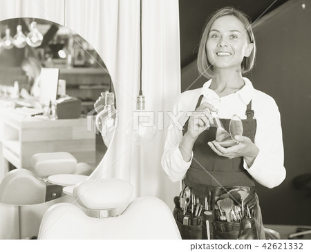 Portrait of adult woman makeup artist standing in the salon Portrait of adult woman makeup artist standing in the salon 42621332