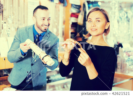 buyer woman choosing bracelet 42621521