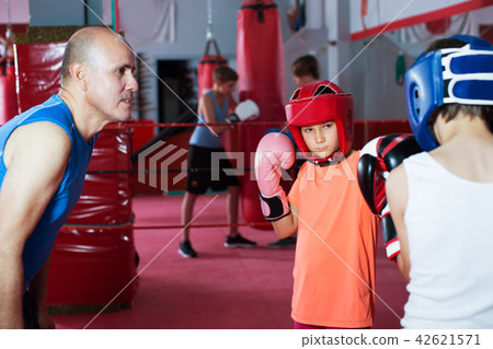 Children training on boxing ring Children training on boxing ring 42621571