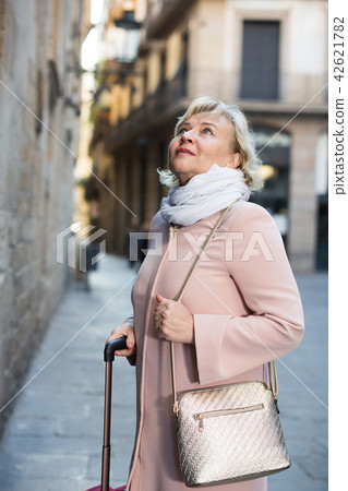 Female in the old city in scarf and coat 42621782