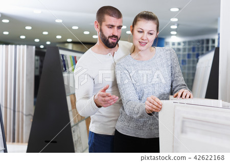 Portrait of couple looking ceramic kitchen ceramic tile 42622168