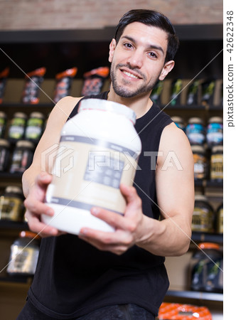 guy buyer showing sport nutrition guy buyer showing sport nutrition 42622348