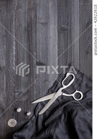 Black wooden sewing background 42622618