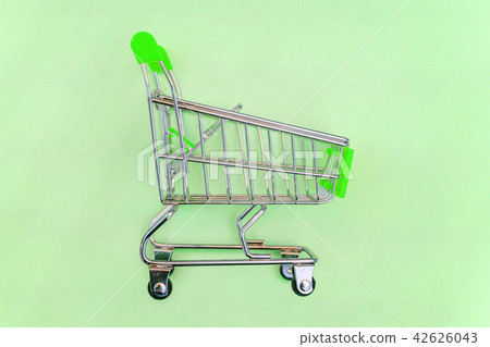 Toy cart on pastel green background Toy cart on pastel green background 42626043