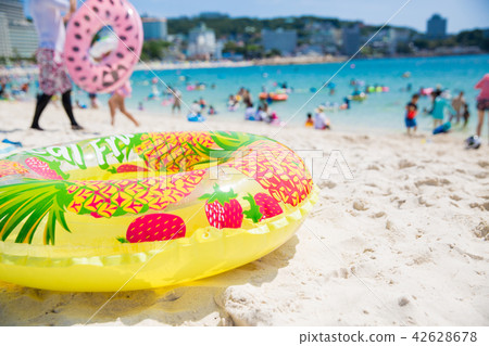 Seas and sandy beaches and floating rings 42628678