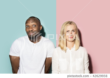 Man and woman posing at studio during quarrel 42629938