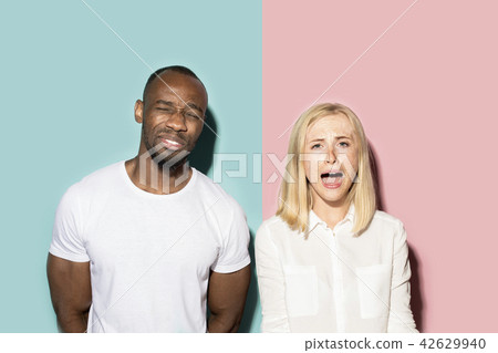 Man and woman posing at studio during quarrel Man and woman posing at studio during quarrel 42629940