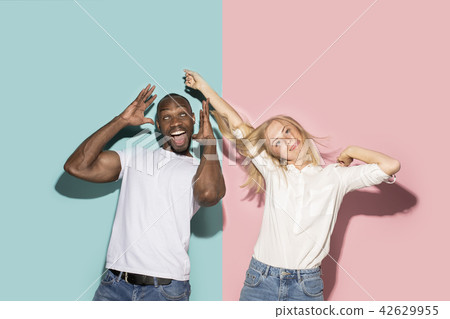 The squint eyed couple with weird expression on blue and pink studio 42629955