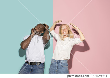 The squint eyed couple with weird expression on blue and pink studio The squint eyed couple with weird expression on blue and pink studio 42629961
