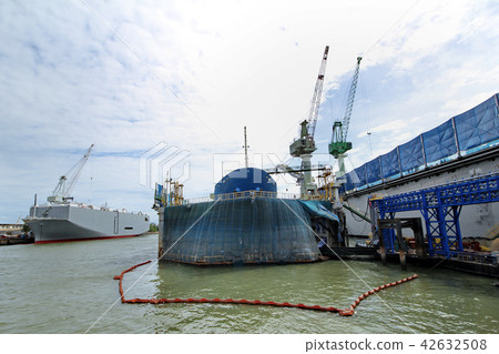 Large commercial ships into floating repair dock. Large commercial ships into floating repair dock. 42632508