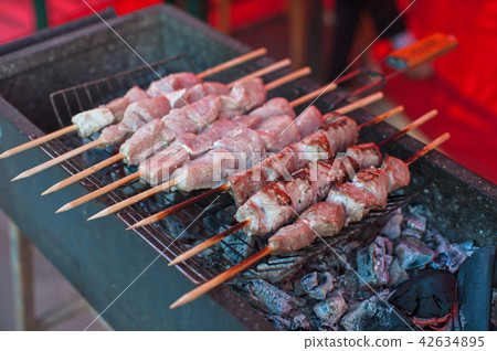 grilling shashlik on a barbecue skewer 42634895