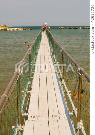 Pier in stainless steel and wood allow the boardin 42635726