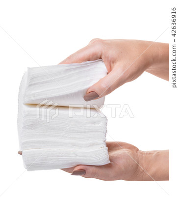 pack of napkins in hands pack of napkins in hands 42636916